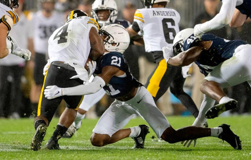 Penn State safety Kevin Winston Jr. stops Iowa’s Leshon Williams during the game on Saturday, Sept. 23, 2023.