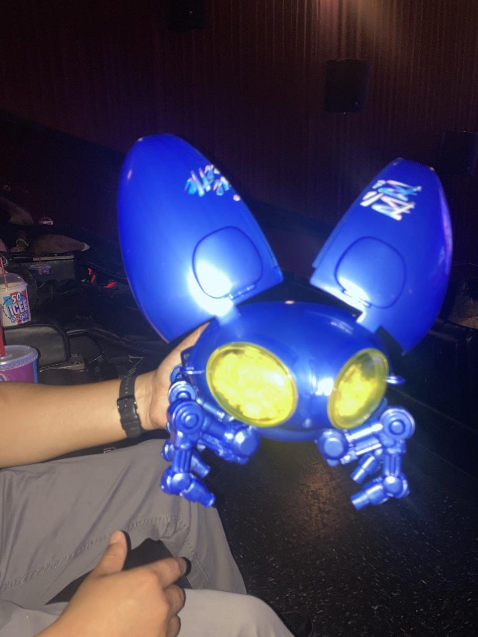 El Paso fans are enjoying getting "Blue Beetle" merchandise including this beetle-shaped popcorn holder for $25, plus tax, available at Cinemark theaters.
