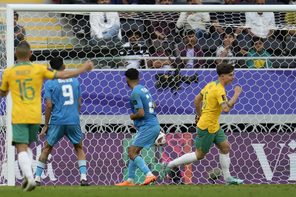 Australia's Jordan Bos, right, celebrates after scoring his side's second goal during the Asian Cup Group B soccer match between Australia and India at Ahmad Bin Ali Stadium in Doha, Qatar, Saturday, Jan. 13, 2024. (AP Photo/Aijaz Rahi)