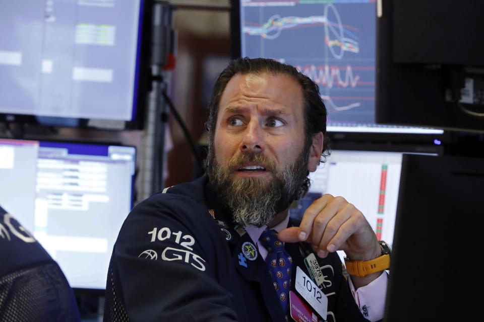 Specialist Micael Pistillo works at his post on the floor of the New York Stock Exchange, Wednesday, Aug. 14, 2019. Stocks are falling sharply after the bond market threw up another warning flag on the economy. (AP Photo/Richard Drew)