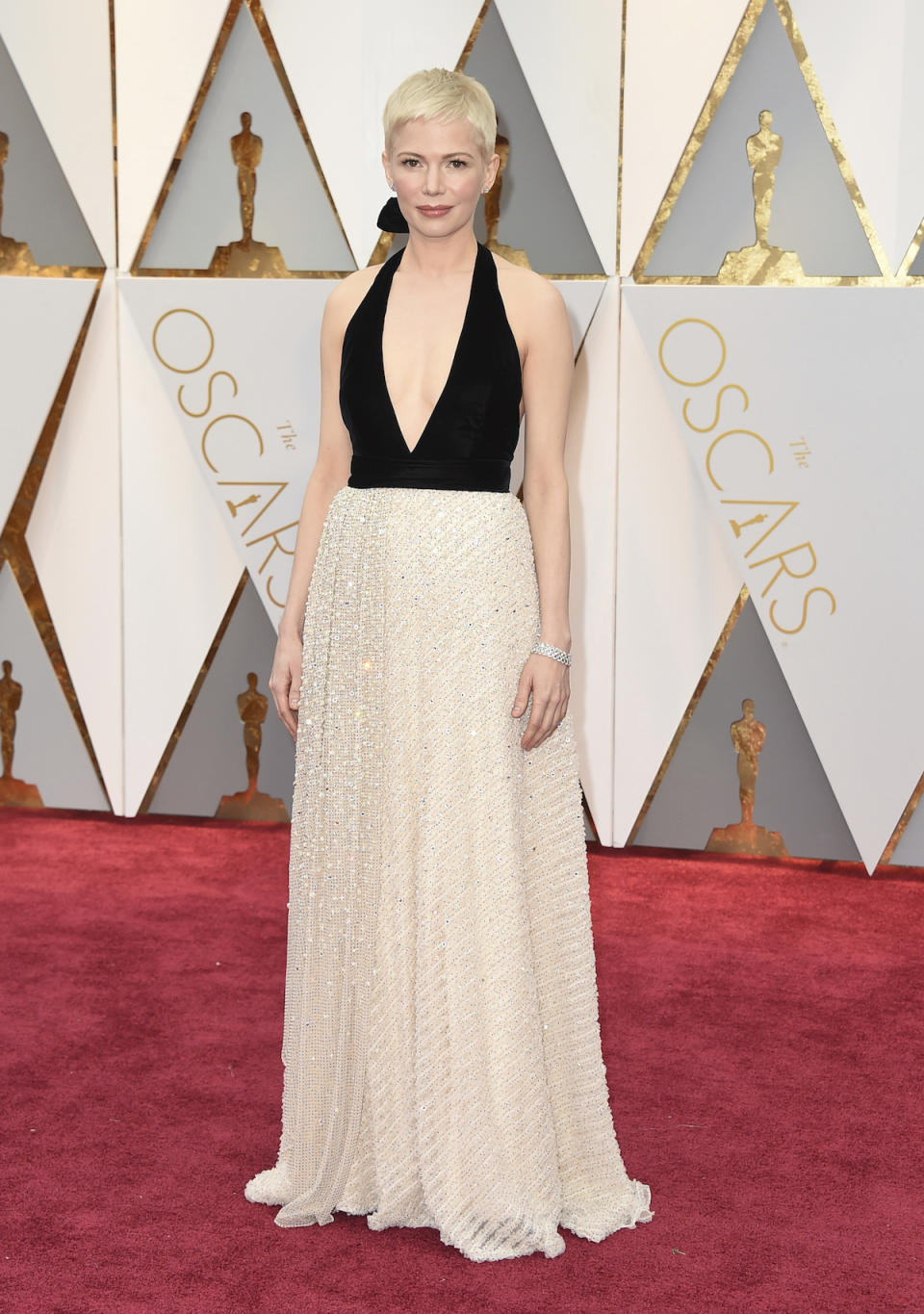 <p>Michelle Williams usually stands out on the red carpet in a bright color or interesting design. Yet for the 2017 Oscars, she didn’t do either, instead choosing a subtle black and white halter gown from Louis Vuitton. <em>(Photo: Getty Images)</em> </p>