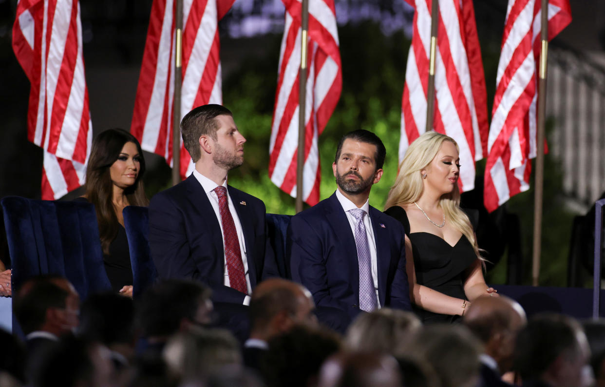 Kimberly Guilfoyle, Eric Trump, Donald Trump Jr, and Tiffany Trump wait for U.S. President Donald Trump's acceptance speech as the 2020 Republican presidential nominee during the final event of the 2020 Republican National Convention on the South Lawn of the White House in Washington, U.S., August 27, 2020. REUTERS/Carlos Barria