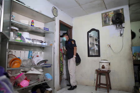 Police search the house of a suspect who they identified as one of the people killed in Thursday's gun and bomb attack in central Jakarta, in Meruya, Jakarta January 15, 2016 in this photo taken by Antara Foto. REUTERS/Agoes Rudianto/Antara Foto