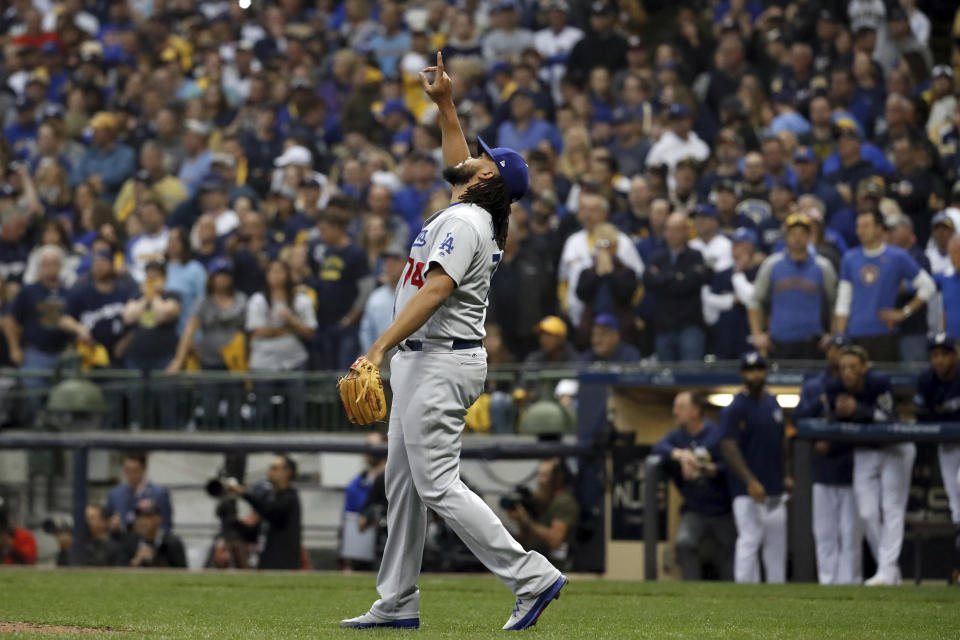 Los Angeles Dodgers relief pitcher Kenley Jansen (74) celebrates after Game 2 of the National League Championship Series baseball game against the Milwaukee Brewers Saturday, Oct. 13, 2018, in Milwaukee. The Dodgers won 4-3. (AP Photo/Jeff Roberson)