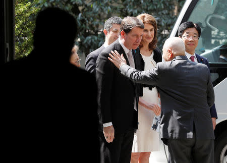 A family member of a Japanese national abducted by North Korean agents greets U.S. ambassador to Japan William Hagerty after their meeting in Tokyo, Japan, April 10, 2018. REUTERS/Kim Kyung-Hoon