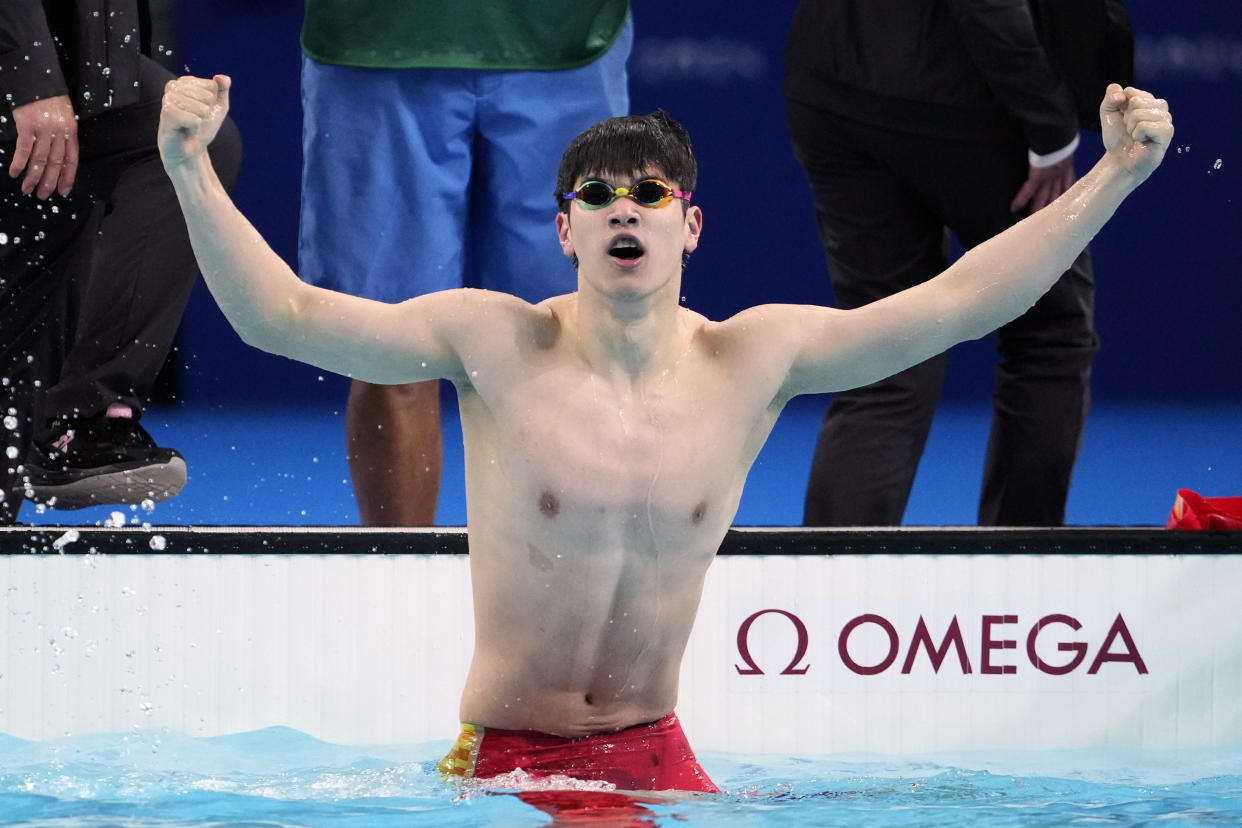 Pan Zhanle, of China, celebrates after winning the men's 100-meter freestyle final at the 2024 Summer Olympics, Wednesday, July 31, 2024, in Nanterre, France. (AP Photo/Matthias Schrader)