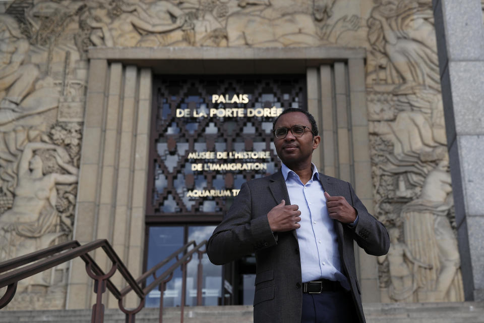 FILE - Pap Ndiaye, a Black French scholar and expert on the U.S. civil rights movement poses for a photo outside France's National Museum of the History of Immigration, in Paris, Thursday, March 11, 2021. Pap Ndiaye, was named Friday May 20, 2022 education minister. Ndiaye was previously in charge of France's state-run immigration museum. In an Associated Press interview last year, Ndiaye said France has to fight racial justice by confronting its often-violent colonial past, noting that "the French are highly reluctant to look at the dark dimensions of their own history." (AP Photo/Francois Mori, File)