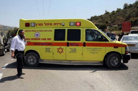 Ambulance is seen at the scene of an attack near the Jewish settlement of Dolev in the Israeli-occupied West Bank