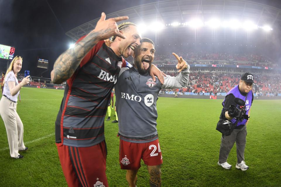 Federico Bernardeschi (left) and Lorenzo Insigne celebrate Toronto FC's 5-1 win over CF Montreal at BMO Field on May 18.