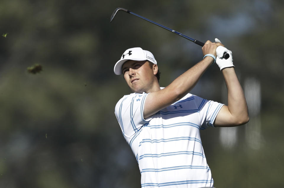 Jordan Spieth sends a divot flying with his second shot on the second hole of the South Course at Torrey Pines during the first round of the Farmers Insurance Open golf tournament Thursday, Jan. 23, 2014, in San Diego. (AP Photo/Lenny Ignelzi)