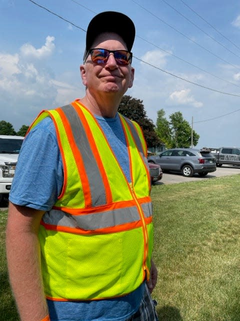 Rich Ketcham, of Ames, helps RAGBRAI catch potholes and road hazards during its annual pre-ride. He rolled into town Tuesday, July 25 with other crew members.