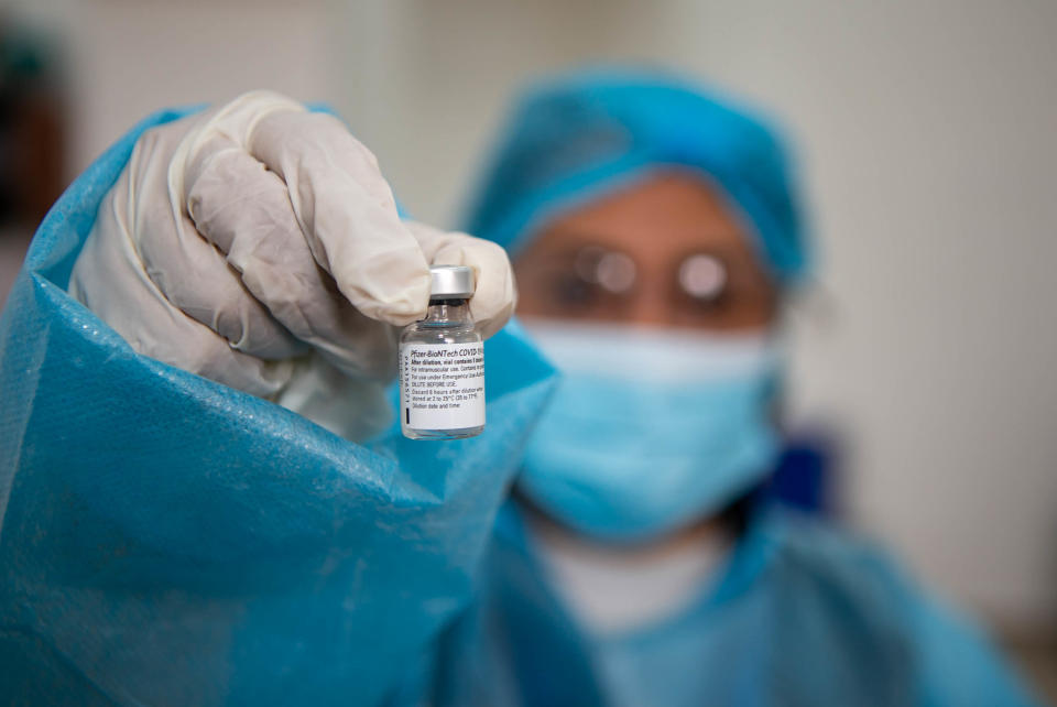 Nurse holds the Pfizer vaccine, in Quito, Ecuador, on January 21, 2021. (Rafael Rodriguez/NurPhoto via Getty Images)