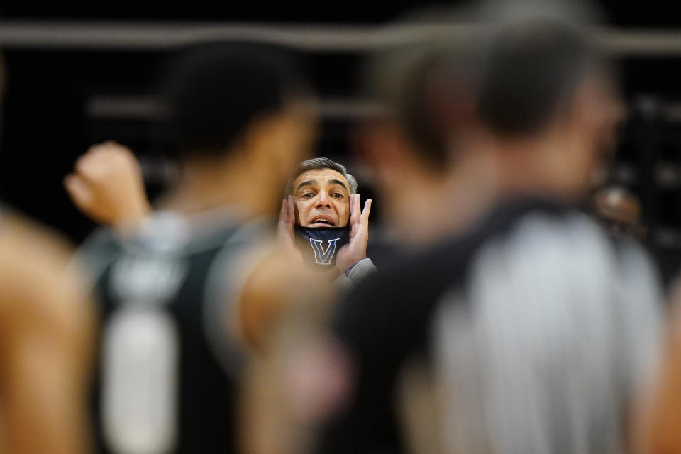 Villanova head coach Jay Wright yells to his team during the first half of an NCAA college basketball game against Georgetown, Sunday, Feb. 7, 2021, in Villanova, Pa. (AP Photo/Matt Slocum)