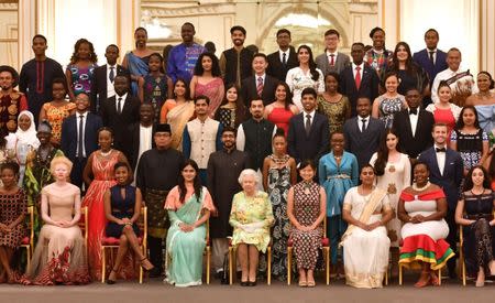 Britain's Queen Elizabeth poses for a picture with some of Queen's Young Leaders at a Buckingham Palace reception following the final Queen's Young Leaders Awards Ceremony, in London, Britain June 26, 2018. John Stillwell/Pool via Reuters