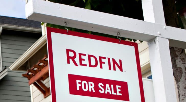 The redfin logo displayed on a for sale sign. RDFN stock