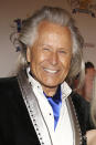 FILE - In this March 2, 2014, file photo, Peter Nygard attends the 24th Night of 100 Stars Oscars Viewing Gala at The Beverly Hills Hotel in Beverly Hills, Calif. Federal authorities on Tuesday, Feb. 25, 2020, raided the Manhattan headquarters of the Canadian fashion mogul Peter Nygard amid claims that he sexually assaulted and trafficked dozens of teenage girls and young women. (Photo by Annie I. Bang /Invision/AP, File)