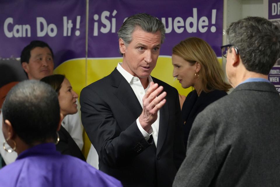 California Gov. Gavin Newsom speaks with people at a Proposition 1 campaign event at the Service Employees International Union office in San Francisco.