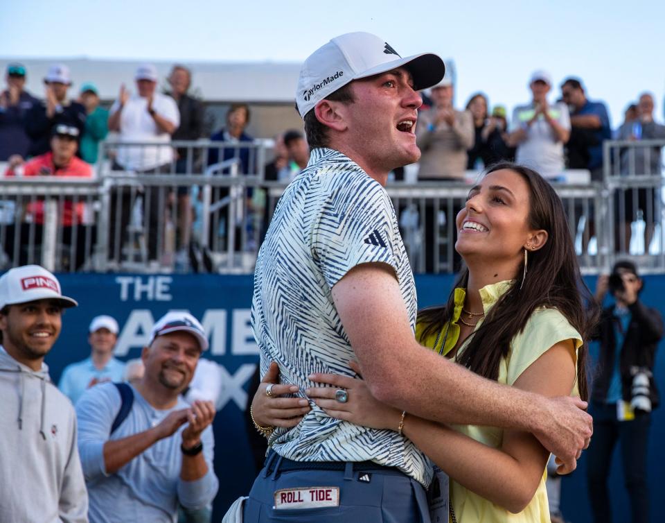 Nick Dunlap hugs his girlfriend Izzy Ellis after winning the 2024 American Express on the Pete Dye Stadium Course at PGA West in La Quinta, California. (Photo: Andy Abeyta/The Desert Sun)