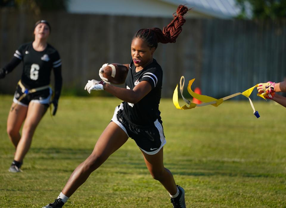 Braden River's Ameria Smith runs up field against Estero in the Class 1A Regional flag football quarterfinal game in Bradenton on Wednesday, April 17, 2024. Braden River rolled over Estero 41-0.