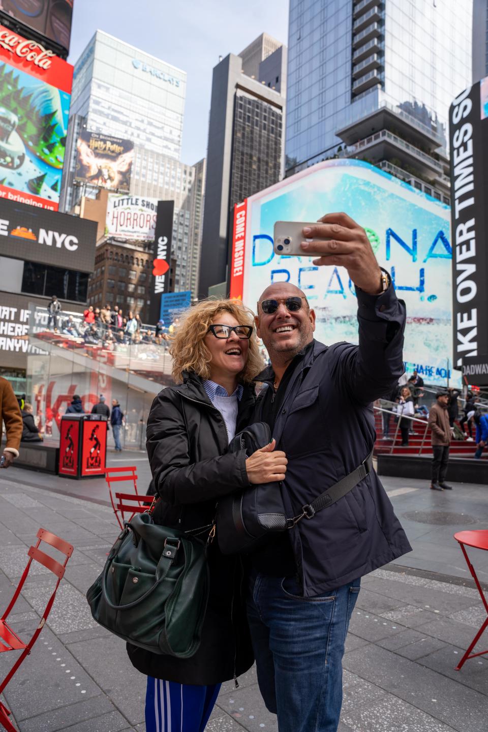 In April, visitors pose in front of towering 3D anamorphic video ad that brought Daytona Beach's "Beach On" marketing campaign to New York's Times Square.