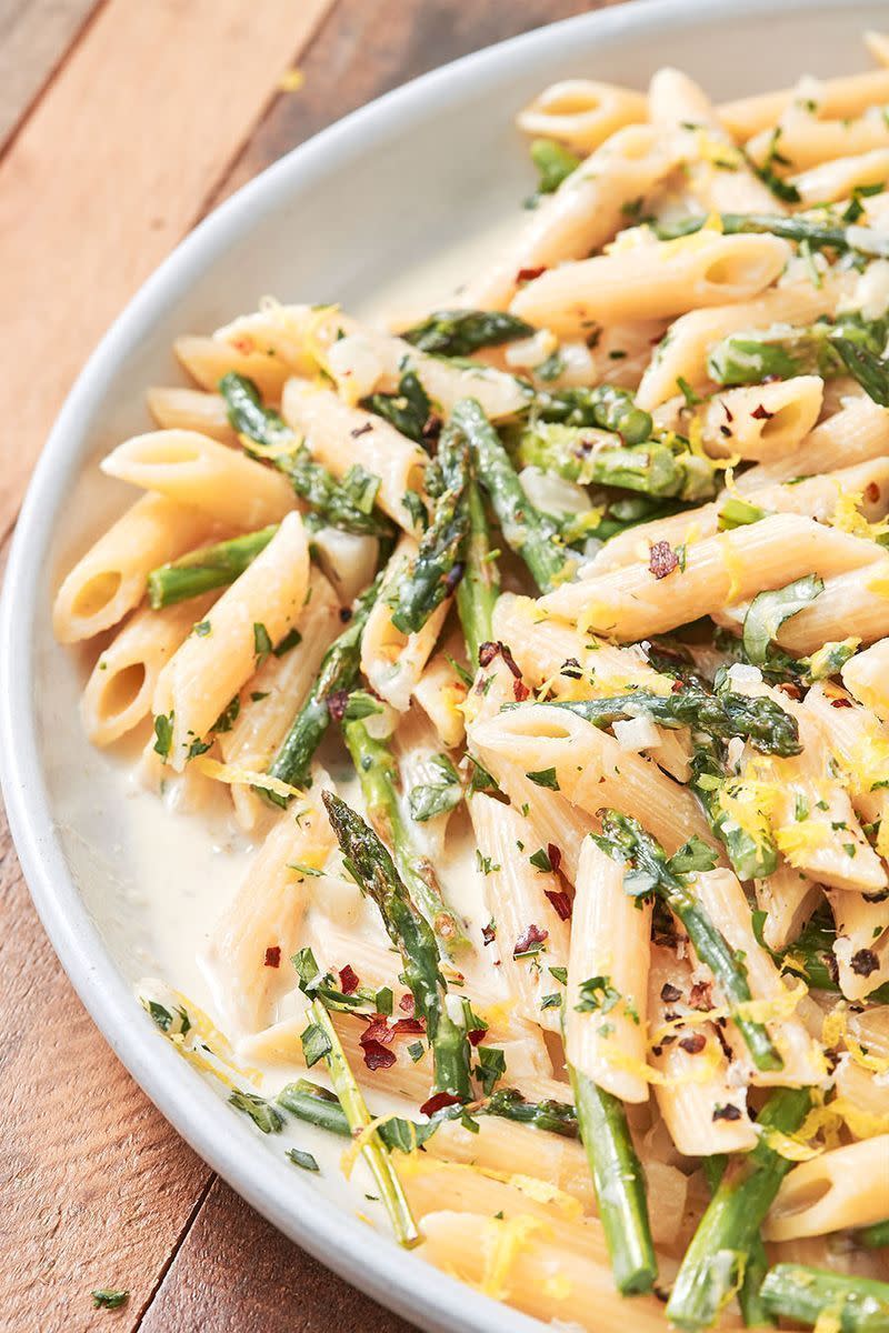 <p>The key to acing this dish is to cook the asparagus until its tips are crispy and stalks slightly blistered. The slight char will add a whole other dimension to the enticing flavour of this vegetable.</p><p>Get the <a href="https://www.delish.com/uk/cooking/recipes/a32247844/lemony-asparagus-pasta-recipe/" rel="nofollow noopener" target="_blank" data-ylk="slk:Lemony Asparagus Pasta;elm:context_link;itc:0;sec:content-canvas" class="link ">Lemony Asparagus Pasta</a> recipe.</p>