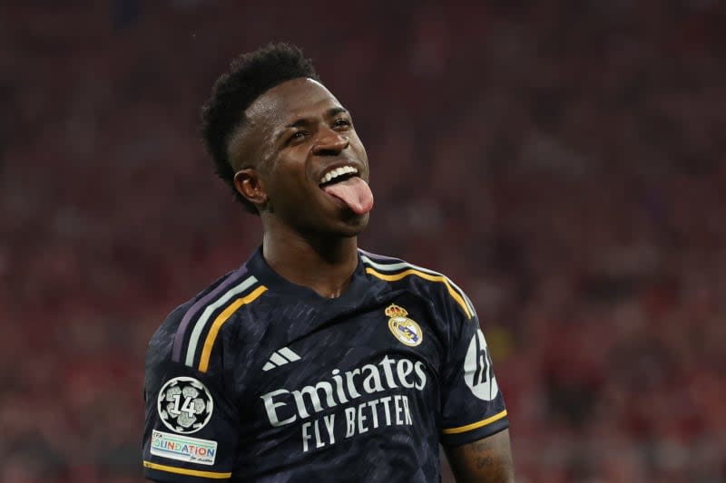 Real Madrid's Vinicius Junior celebrates scoring his side's second goal during the UEFA Champions League semi-final first leg soccer match between Bayern Munich and Real Madrid at Allianz Arena. Matthias Balk/dpa