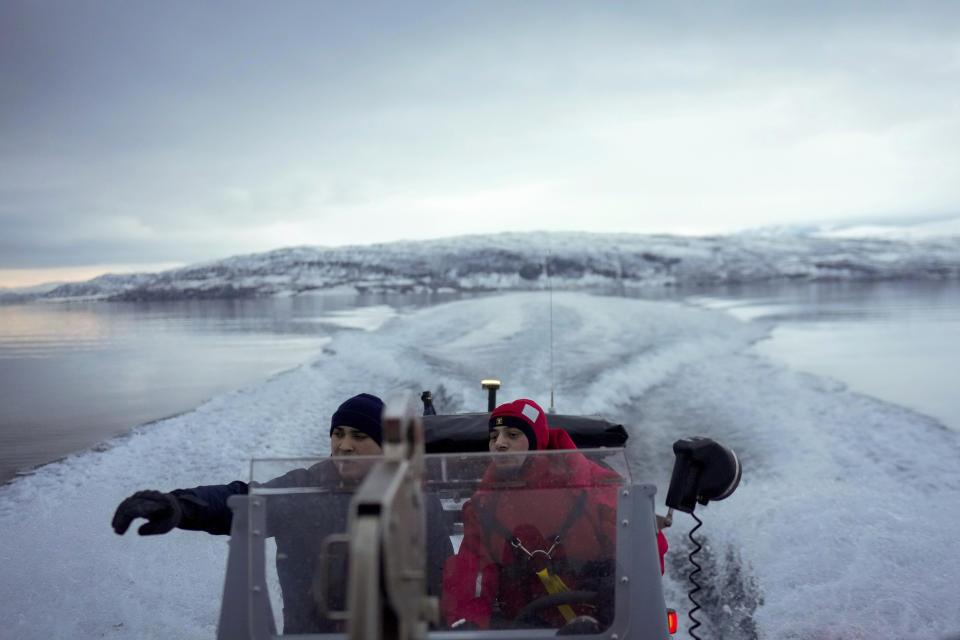 French sailors takes part of a reconnaissance patrol, on a zodiac of the French navy frigate Normandie into a Norwegian fjord, north of the Arctic circle, Wednesday March 6, 2024. The French frigate is part of a NATO force conducting exercises in the seas, north of Norway, codenamed Steadfast Defender, which are the largest conducted by the 31 nation military alliance since the cold war. (AP Photo/Thibault Camus)