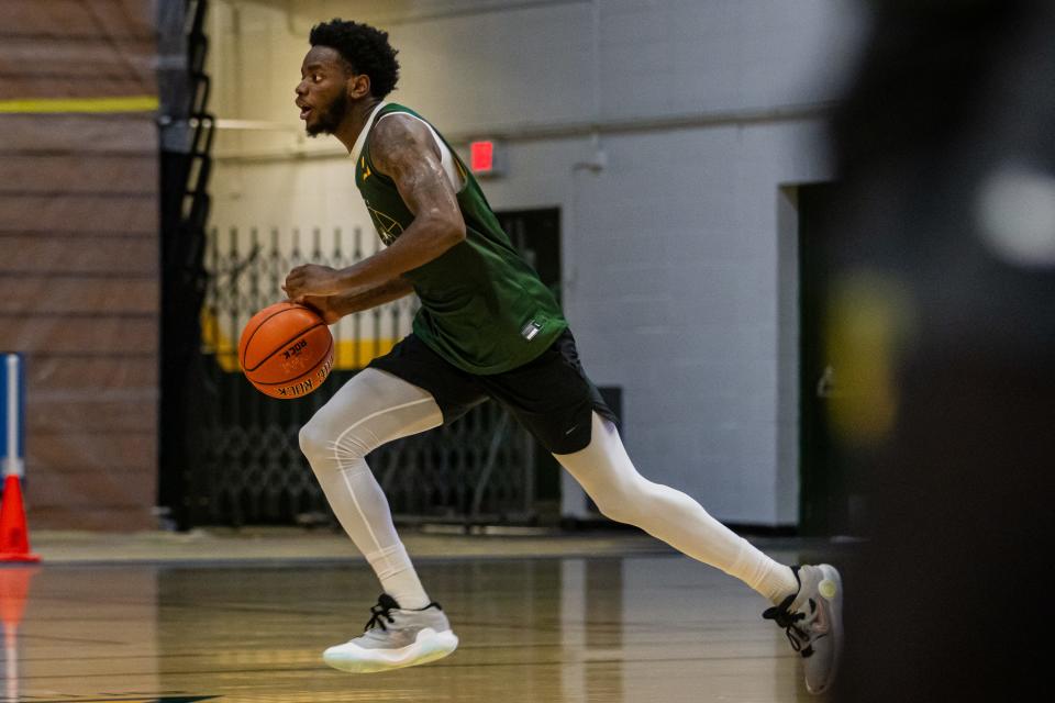 Shamir Bogues dribbles during a UVM men's basketball summer practice earlier this month at Patrick Gym.