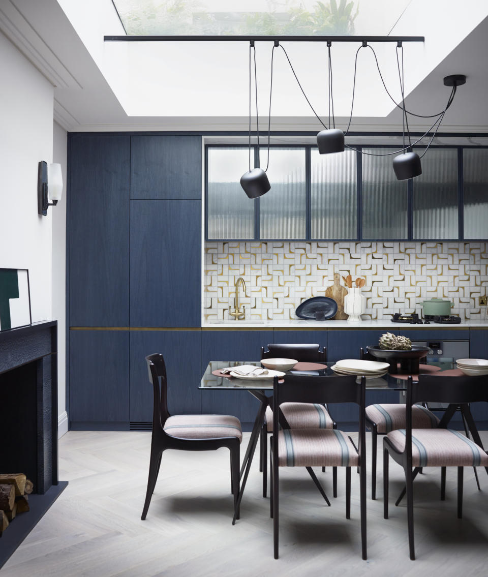 <p> ‘The graphical and playful impact that the backsplash has on this space is a real conversation-starter,’ says Irene Gunter, Co-Founder of Gunter & Co. </p> <p> ‘When designing a kitchen there always needs to be that one eye catching feature. In this case the tiles were chosen before anything else and the metal trims and cabinet door finish came after, the blue was chosen as a neutral which in the case of this colourful project made total sense </p> <p> 'Given the cost of the luxe marble tiles with satin brass inlay, we knew that we needed to use the tiles sparingly. That’s why this single-wall kitchen configuration turned out to be the perfect fit.’ </p> <p> We love the detailing of these kitchen tiles and how they work against the sleek blue units. The result is an exciting color scheme that incorporates both pattern and plain elements that’s both bold and contemporary.   </p>