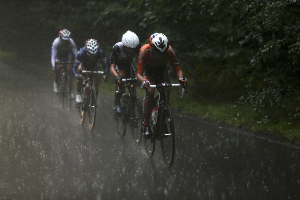 LONDON, ENGLAND - JULY 29: (R-L) Marianne Vos of Netherlands, Elizabeth Armitstead of Great Britain, Kristin Armstrong of the United States and Olga Zabelinskaya of Russia cycle in the rain during the Women's Road Race Road Cycling on day two of the London 2012 Olympic Games on July 29, 2012 in London, England. (Photo by Stefano Rellandini - IOPP Pool Getty Images)