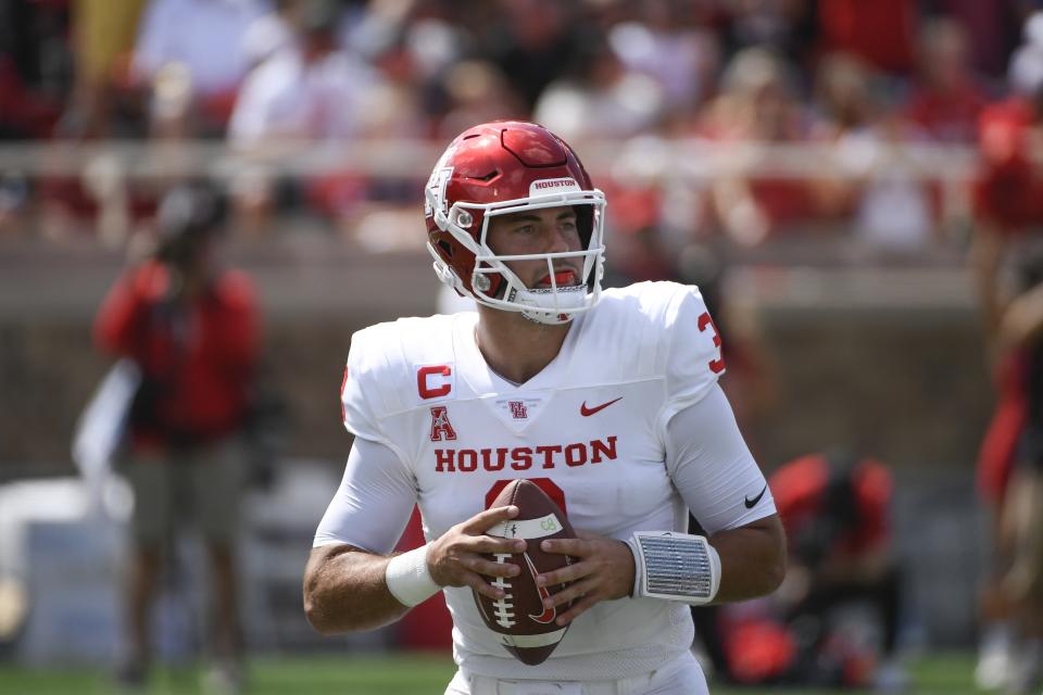 Houston quarterback Clayton Tune (3) drops back to pass against Texas Tech during the first half of an NCAA college football game Saturday, Sept. 10, 2022, in Lubbock, Texas. (AP Photo/Justin Rex)