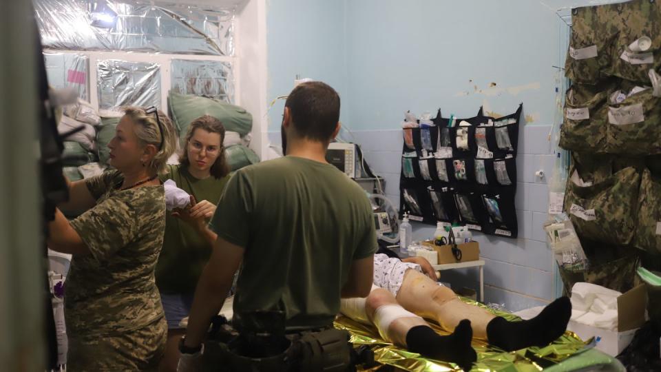 A Ukrainian medical team treats injured troops at a stabilization point near Bakhmut in July. Troops refer to the medical personnel as 