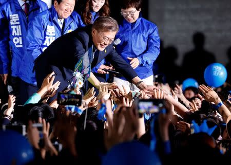 Moon Jae-in, the presidential candidate of the Democratic Party of Korea, attends his election campaign rally in Seoul, South Korea May 8, 2017. REUTERS/Kim Kyung-Hoon