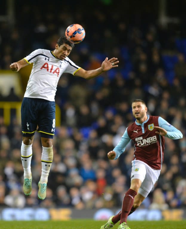 Paulinho, left, in action with English club Tottenham, has also been snapped up by the World Cup-winning manager of Guangzhou Evergrande, Luiz Felipe Scolari, as he plots to further the reach of China’s top club across Asia and beyond Tottenham Hotspur's Brazilian midfielder Paulinho (L) heads the ball during the English FA Cup Third Round football match replay betweenTottenham Hotspur and Burnley at White Hart Lane in London, on January 14, 2015. Tottenham won the match 4-2. AFP PHOTO / GLYN KIRK RESTRICTED TO EDITORIAL USE. NO USE WITH UNAUTHORIZED AUDIO, VIDEO, DATA, FIXTURE LISTS, CLUB/LEAGUE LOGOS OR LIVE SERVICES. ONLINE IN-MATCH USE LIMITED TO 45 IMAGES, NO VIDEO EMULATION. NO USE IN BETTING, GAMES OR SINGLE CLUB/LEAGUE/PLAYER PUBLICATIONS