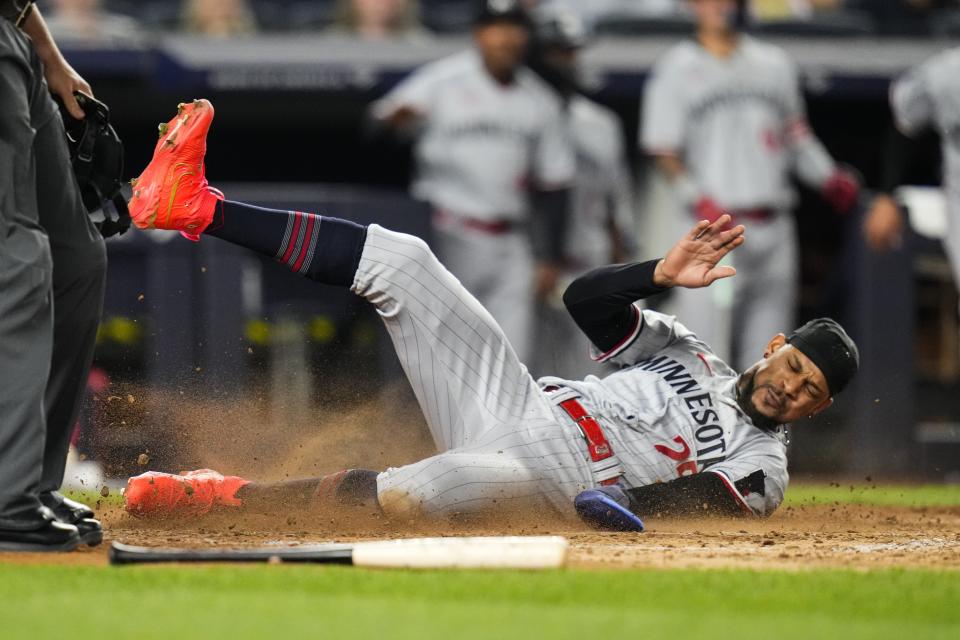 Minnesota Twins' Byron Buxton scores on a two-run double by Carlos Correa during the eighth inning of the team's baseball game against the New York Yankees on Friday, April 14, 2023, in New York. The Twins won 4-3. (AP Photo/Frank Franklin II)