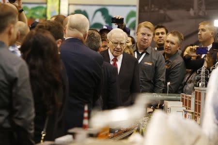 Warren Buffett stops at the BNSF Railway booth in the exhibit hall during the Berkshire Hathaway Annual Shareholders Meeting at the CenturyLink Center in Omaha, Nebraska, U.S. April 30, 2016. REUTERS/Ryan Henriksen