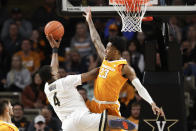 Vanderbilt guard Jordan Wright (4) drives against Tennessee guard Jordan Bowden (23) during the first half of an NCAA college basketball game Saturday, Jan. 18, 2020, in Nashville, Tenn. (AP Photo/Mark Humphrey)