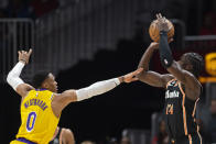 Atlanta Hawks forward AJ Griffin shoots a 3-pointer against Los Angeles Lakers guard Russell Westbrook during the first half of an NBA basketball game Friday, Dec. 30, 2022, in Atlanta. (AP Photo/Hakim Wright Sr.)
