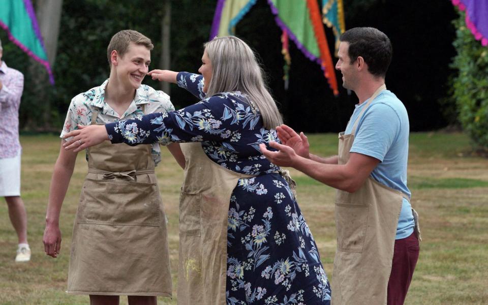 Peter is congratulated by his fellow finalists