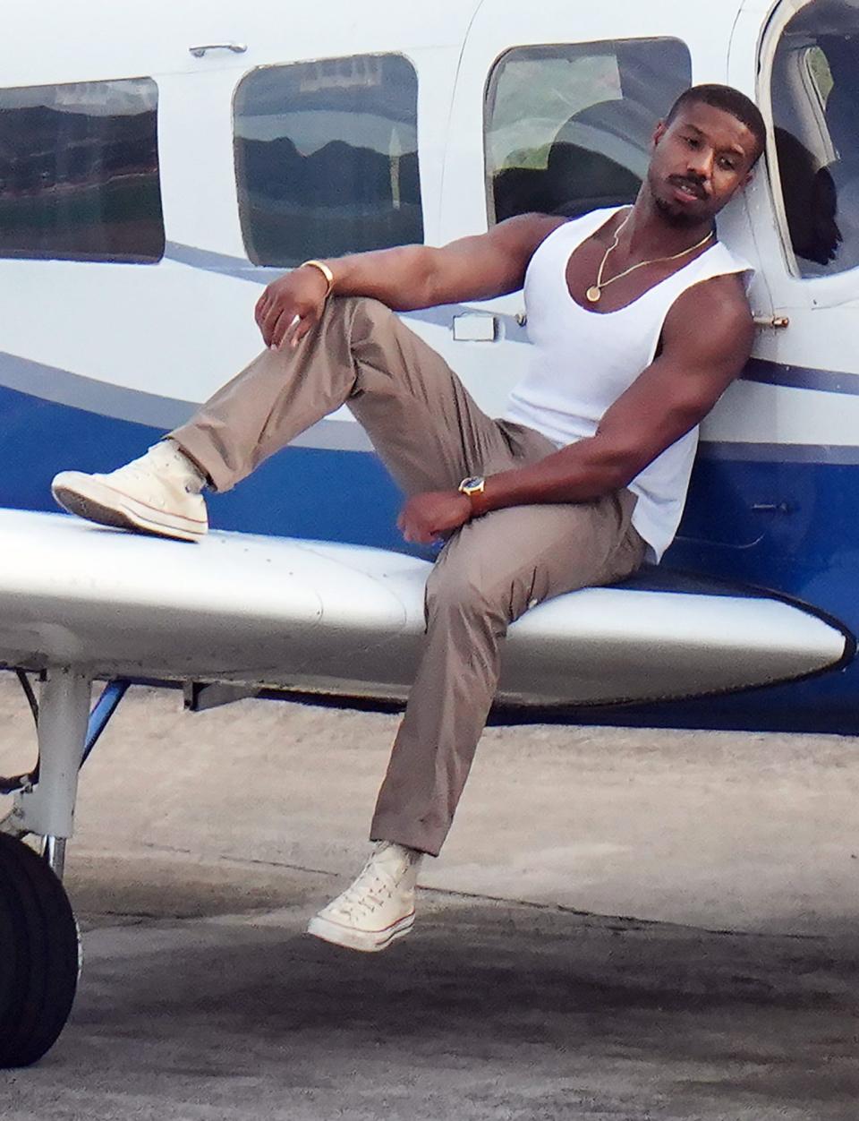 <p>Michael B. Jordan sizzles in a tank top and gold accessories during his photoshoot for <em>Men's Health</em> on Monday in St. Bart's.</p>