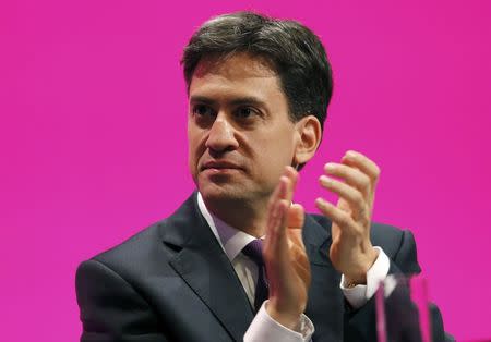 Britain's opposition Labour Party leader Ed Miliband applauds during the speech by shadow chancellor Ed Balls at the Labour Party's annual conference in Manchester, northern England September 22, 2014. REUTERS/Suzanne Plunkett