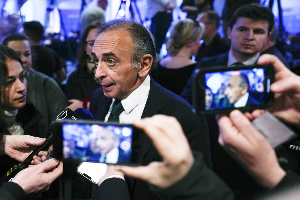 French politician Eric Zemmour, center, speaks with the media as he arrives for the National Conservatism conference in Brussels, Wednesday, April 17, 2024. (AP Photo/Virginia Mayo)