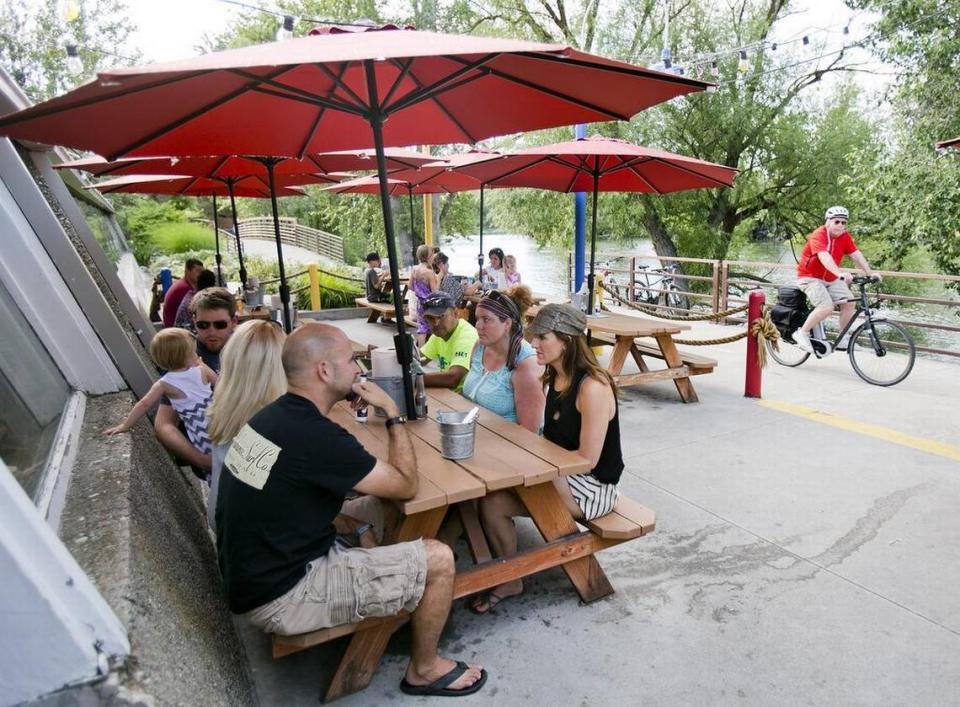 Patrons enjoy a little scenery with their crab legs on the patio of Joe’s Crab Shack.