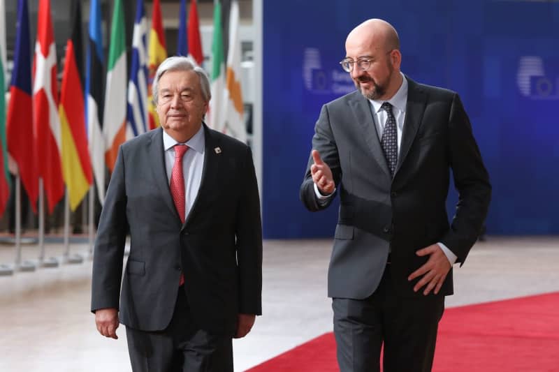 United Nations Secretary General Antonio Guterres and President of the European Council Charles Michel, arrive to attend a round table meeting at the EU summit in Brussels. -/European Council/dpa