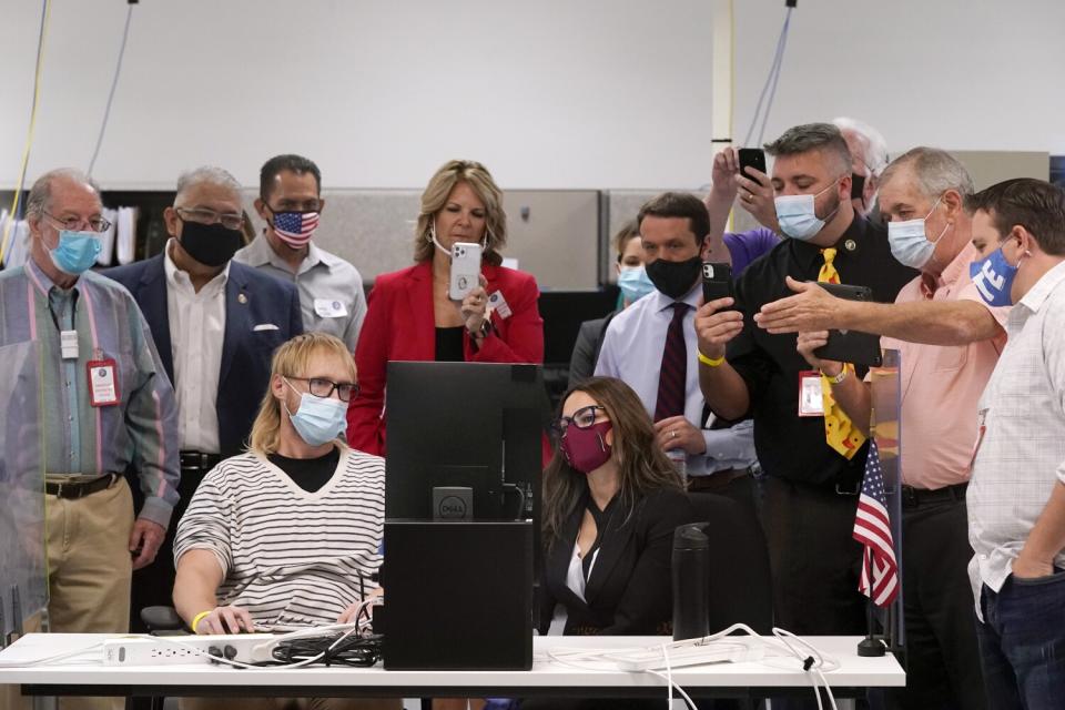 Arizona election staffers participate in a ballot adjudication test.