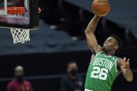 Boston Celtics' Aaron Nesmith goes up for a dunk during the first half of the team's NBA basketball game against the Cleveland Cavaliers, Wednesday, May 12, 2021, in Cleveland. (AP Photo/Tony Dejak)