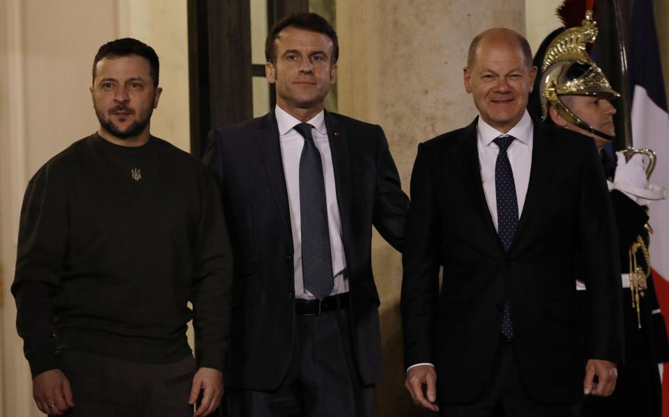 President Volodymyr Zelensky is welcomed by French President Emmanuel Macron and German Chancellor Olaf Scholz upon his arrival at the Elysee presidential palace - Getty