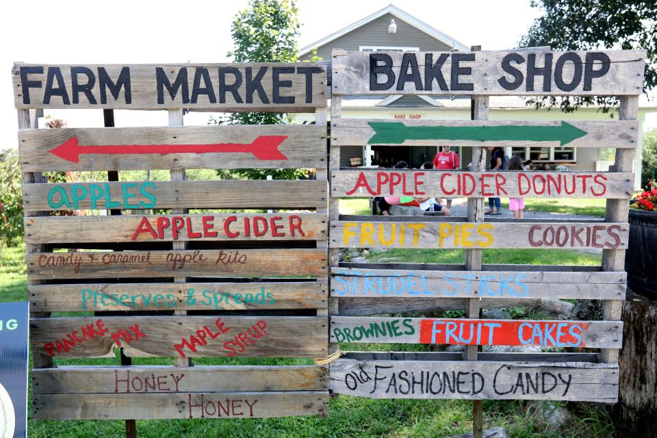 Signs posted for the farm market and bake shop at Wilkens Fruit & Fir Farm in Yorktown Heights Sept. 3, 2018 during the first weekend of apple picking for the season. 