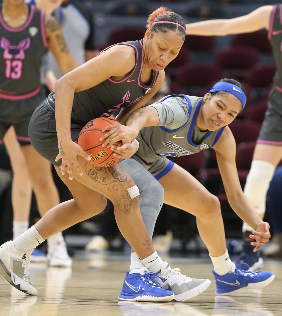 University of Akron guard Jordyn Dawson steals the ball from Buffalo's Summer Hemphill in a Mid American Conference semifinal Friday at Rocket Mortgage FieldHouse. The Bulls won 82-43. [Phil Masturzo/Beacon Journal]