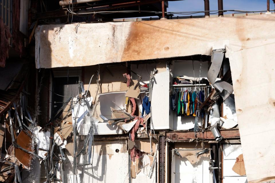 The rear part of the building was left exposed after several apartments came down on Sunday evening (Quad City Times)